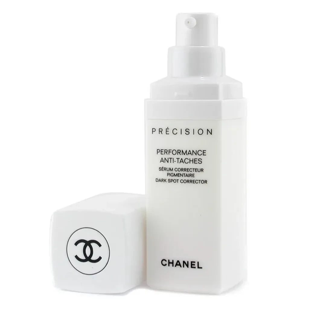 A dark spot corrector roll-on bottle with a metal applicator
