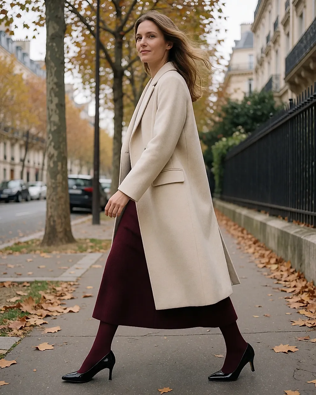 Sandro long wool coat, burgundy bottom half and black patent court shoes, out on the street