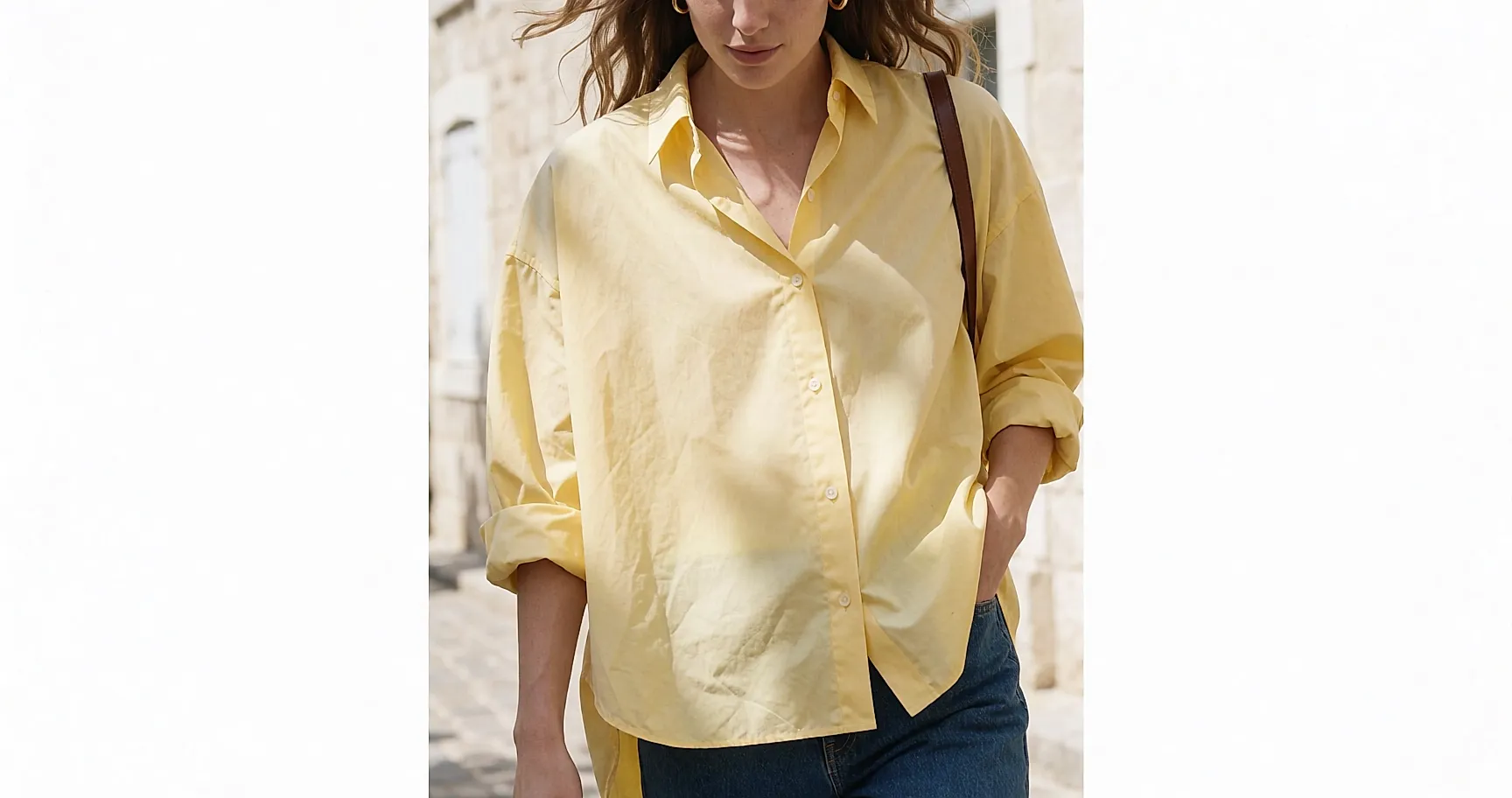 A butter-yellow blouse worn with straight jeans in town