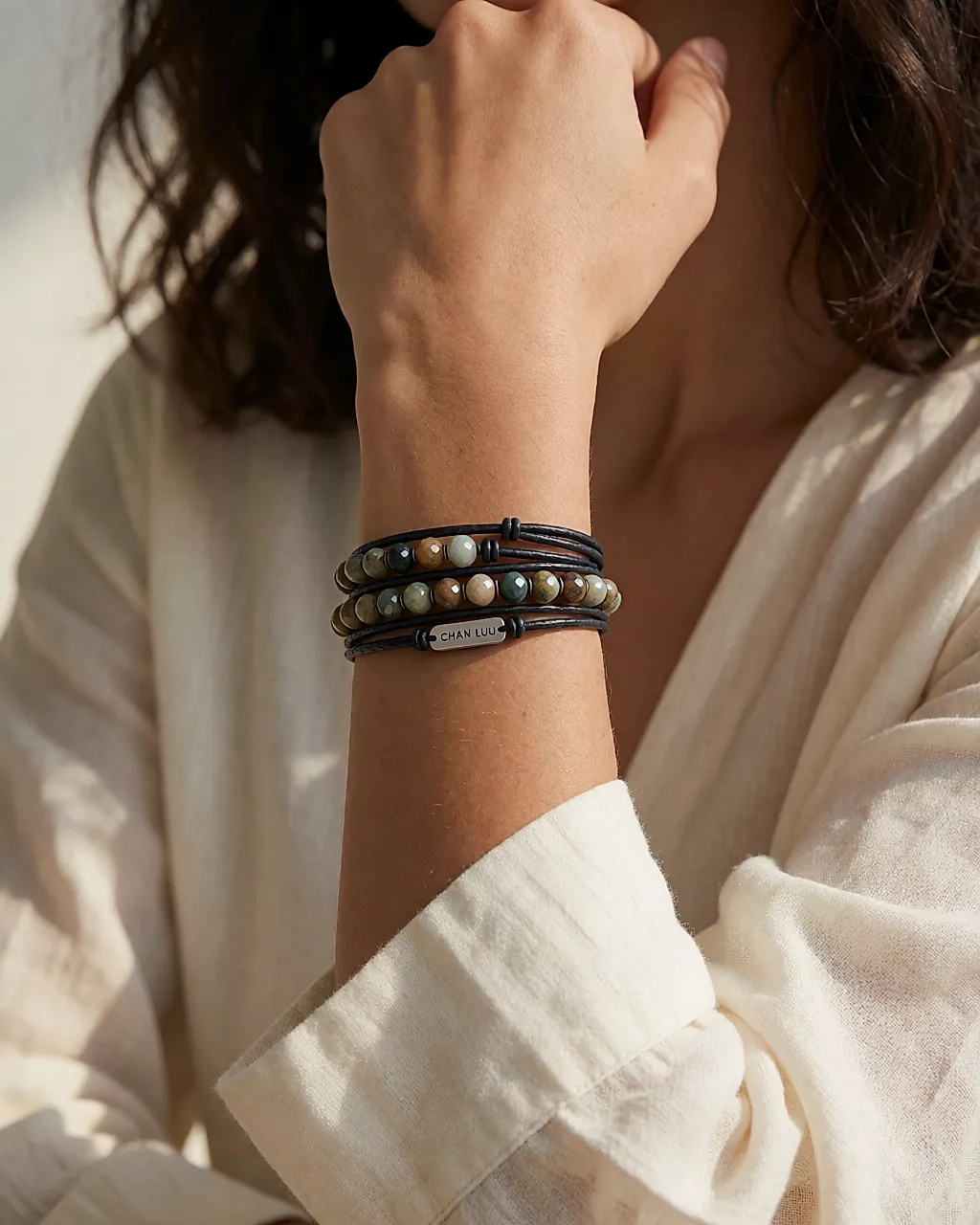 Multi-wrap leather bracelet with stones worn on the wrist